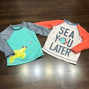 2 12-month rash guards.